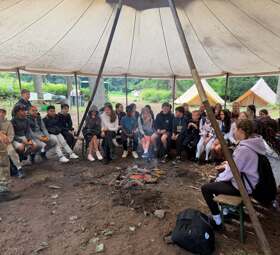 Under the canvas